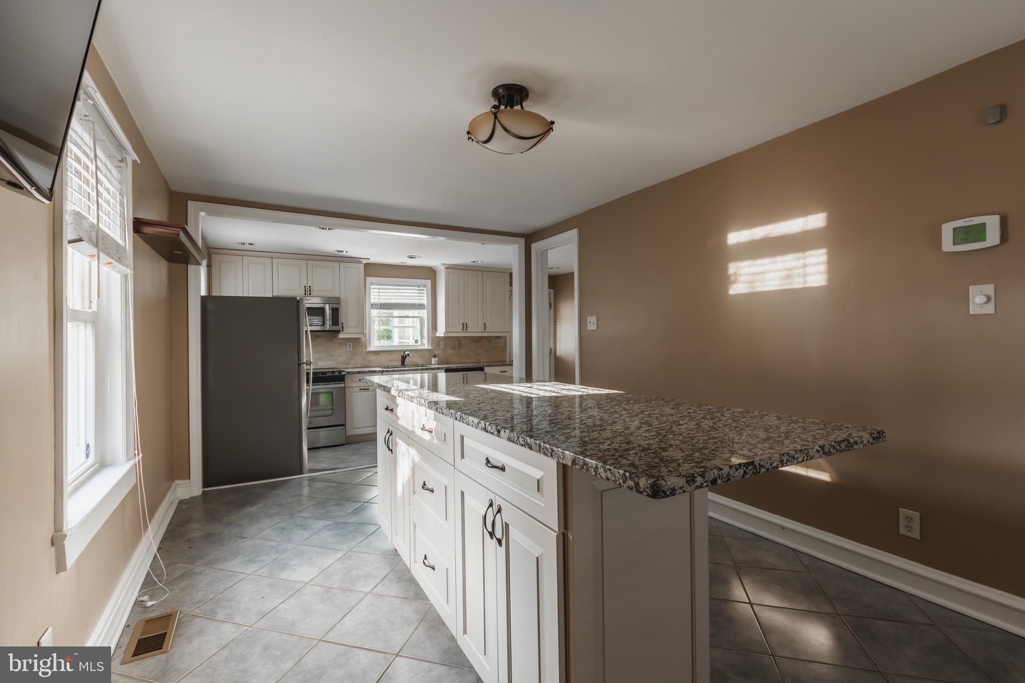 23 Sunset Road Newark, DE 19711 - Photo 10 of 25 a kitchen with granite countertop a refrigerator and a sink