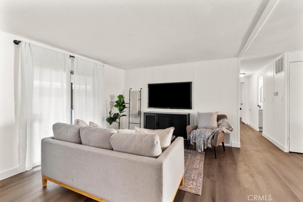 300 North Rampart Street, Unit 127 Orange, CA 92868 - Photo 12 of 28 Living Room area of the home at 300 N Rampart St TRAILER 127, Orange, CA. Features ample natural light and open-concept design