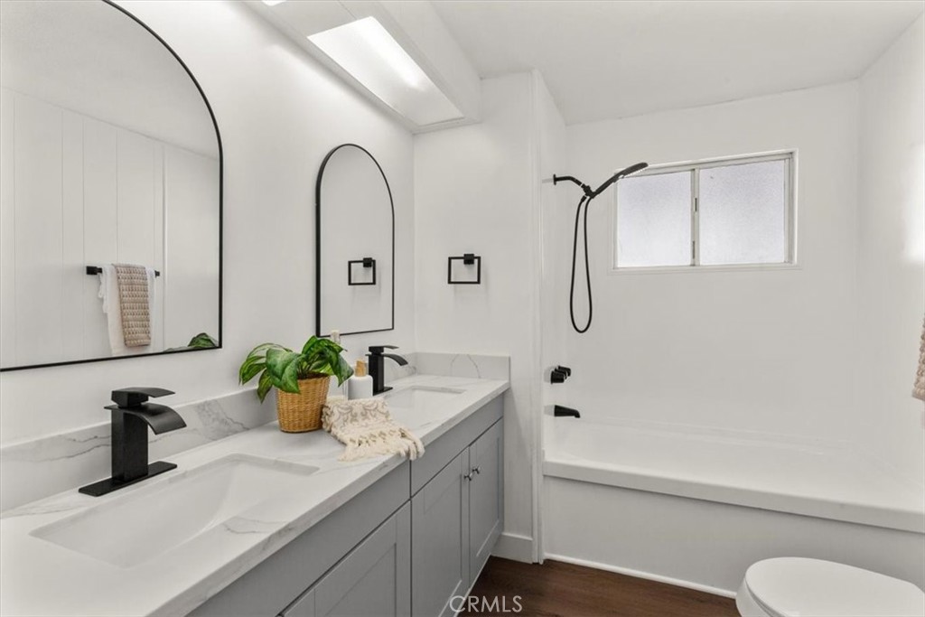 300 North Rampart Street, Unit 127 Orange, CA 92868 - Photo 15 of 37 Main Bathroom of the home at 300 N Rampart St TRAILER 127, Orange, CA. Features a modern vanity and a shower/tub combination.