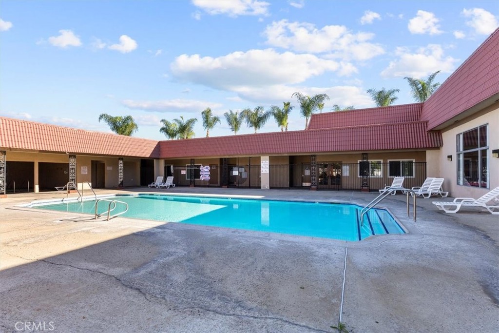 300 North Rampart Street, Unit 127 Orange, CA 92868 - Photo 28 of 37 Pool Area within the community of 300 N Rampart St TRAILER 127, Orange, CA. Offers a refreshing space for relaxation and enjoyment on sunny days
