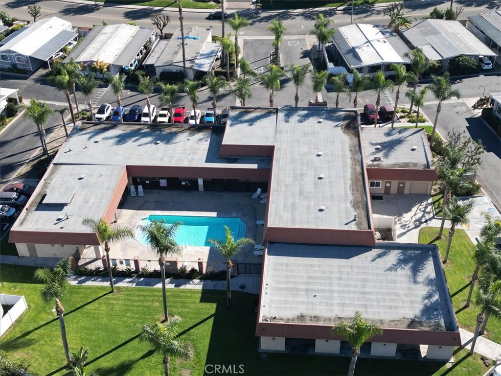 300 North Rampart Street, Unit 127 Orange, CA 92868 - Photo 30 of 37 Aerial View of Community for the property at 300 N Rampart St TRAILER 127, Orange, CA. Highlights the layout of the mobile home park and communal areas like the pool/clubhouse