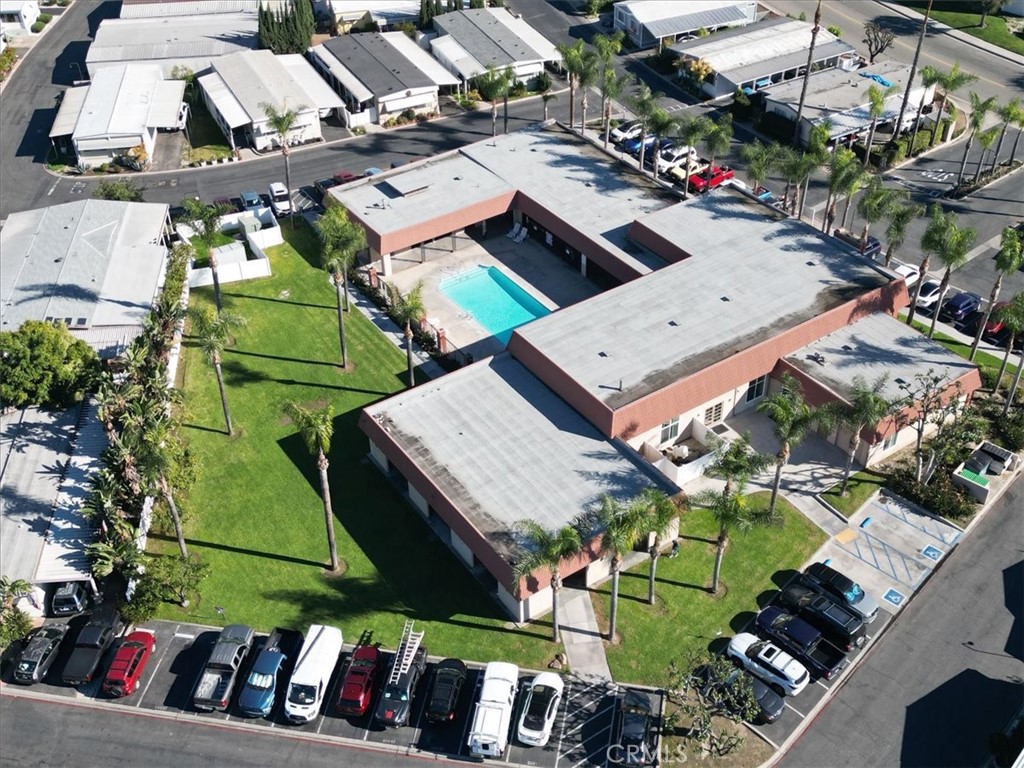 300 North Rampart Street, Unit 127 Orange, CA 92868 - Photo 31 of 37 Aerial View of Community for the property at 300 N Rampart St TRAILER 127, Orange, CA. Highlights the layout of the mobile home park and communal areas like the pool/clubhouse