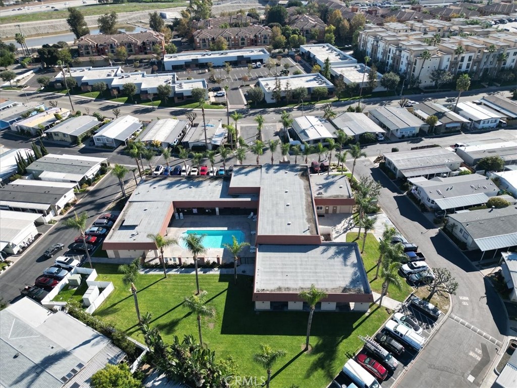 300 North Rampart Street, Unit 127 Orange, CA 92868 - Photo 32 of 37 Aerial View of Community for the property at 300 N Rampart St TRAILER 127, Orange, CA. Highlights the layout of the mobile home park and communal areas like the pool/clubhouse