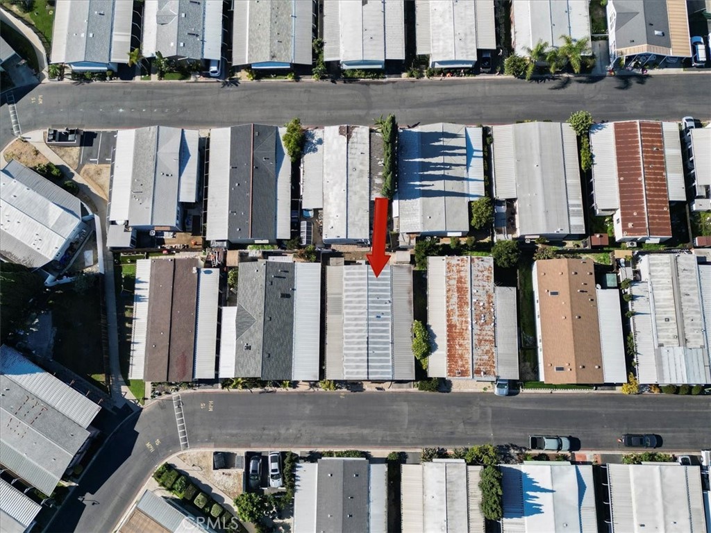 300 North Rampart Street, Unit 127 Orange, CA 92868 - Photo 33 of 37 Aerial View of the home at 300 N Rampart St TRAILER 127, Orange, CA. Shows the property footprint and surrounding lot features