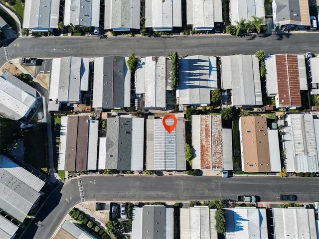 an aerial view of a multi story parking building