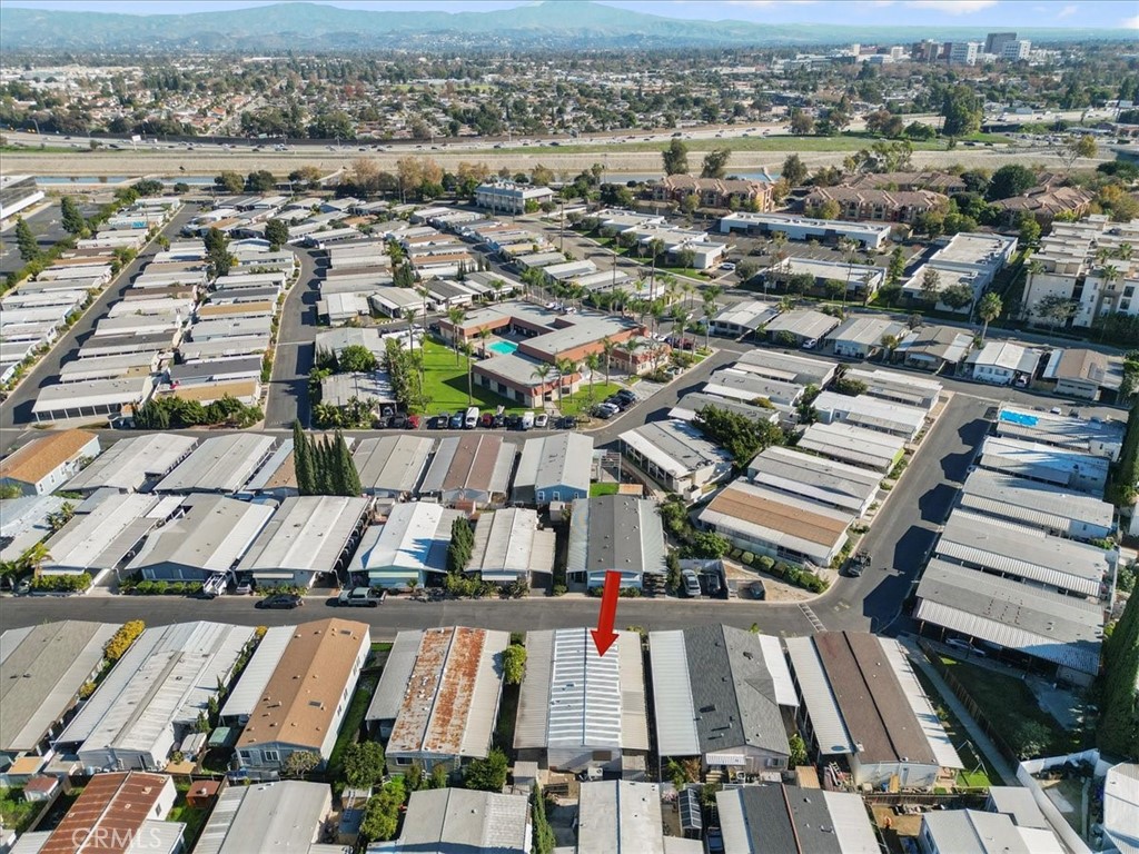 300 North Rampart Street, Unit 127 Orange, CA 92868 - Photo 35 of 37 Aerial View of the home at 300 N Rampart St TRAILER 127, Orange, CA. Shows the property footprint and surrounding lot features