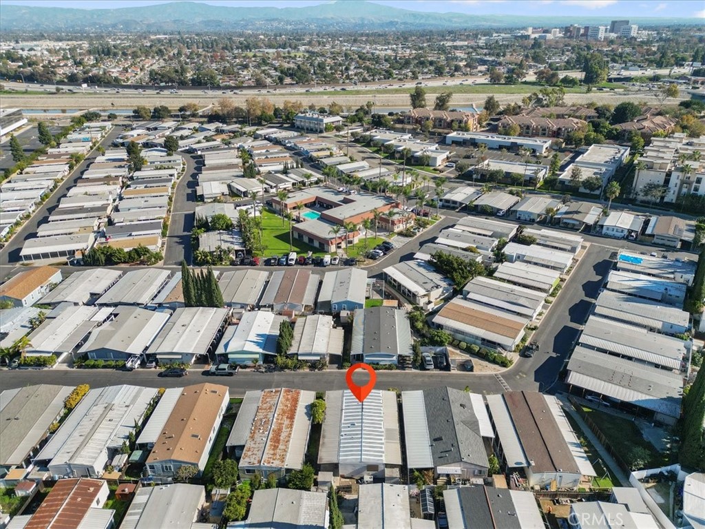 300 North Rampart Street, Unit 127 Orange, CA 92868 - Photo 36 of 37 Aerial View of the home at 300 N Rampart St TRAILER 127, Orange, CA. Shows the property footprint and surrounding lot features