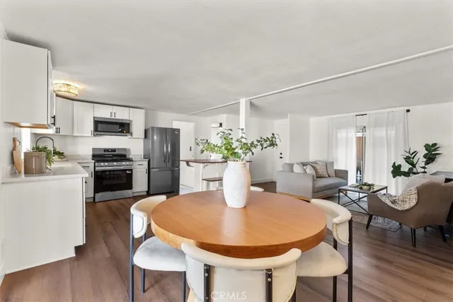 a kitchen with a table and chairs in it