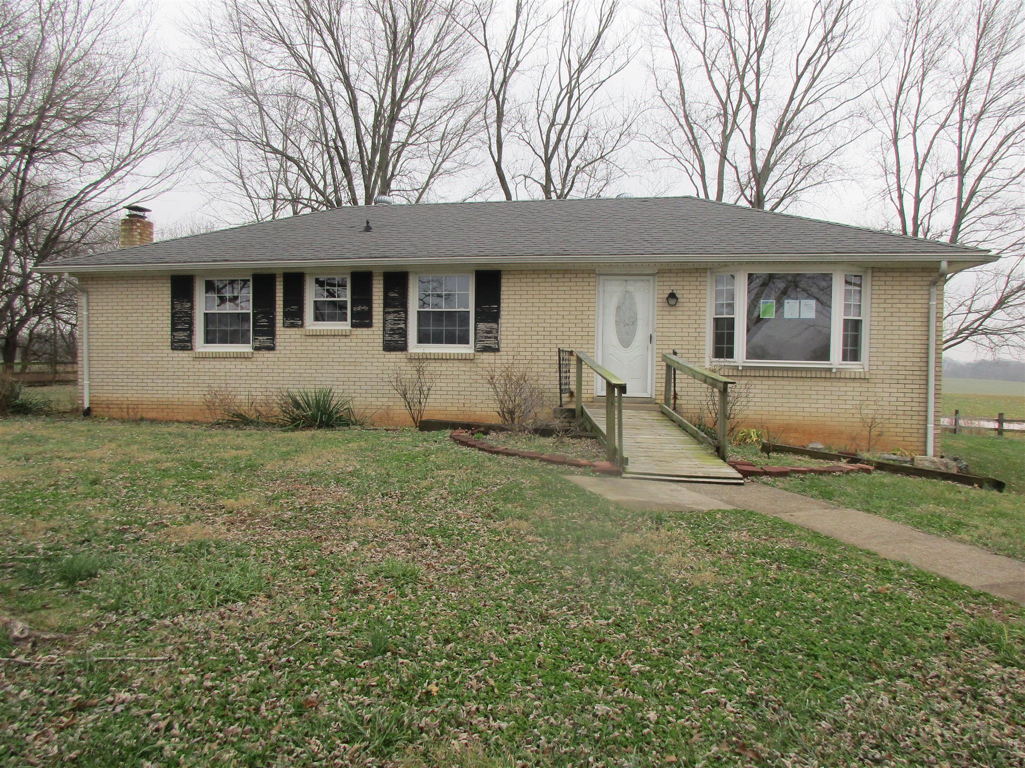 3779 Buck Road Clarksville, TN 37043 - Photo 1 of 12 a front view of a house with garden