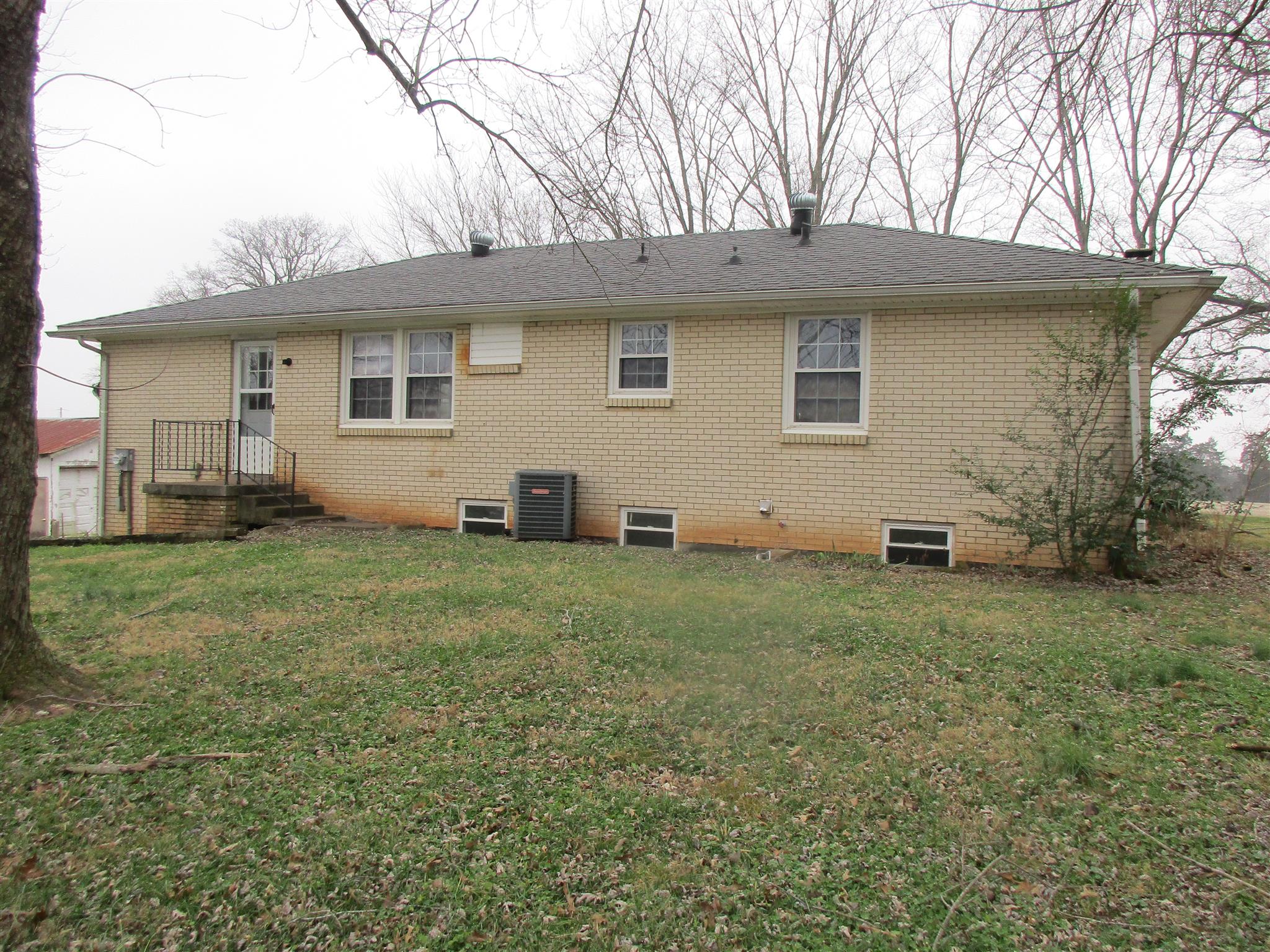 3779 Buck Road Clarksville, TN 37043 - Photo 2 of 12 a view of a backyard with a garden and plants