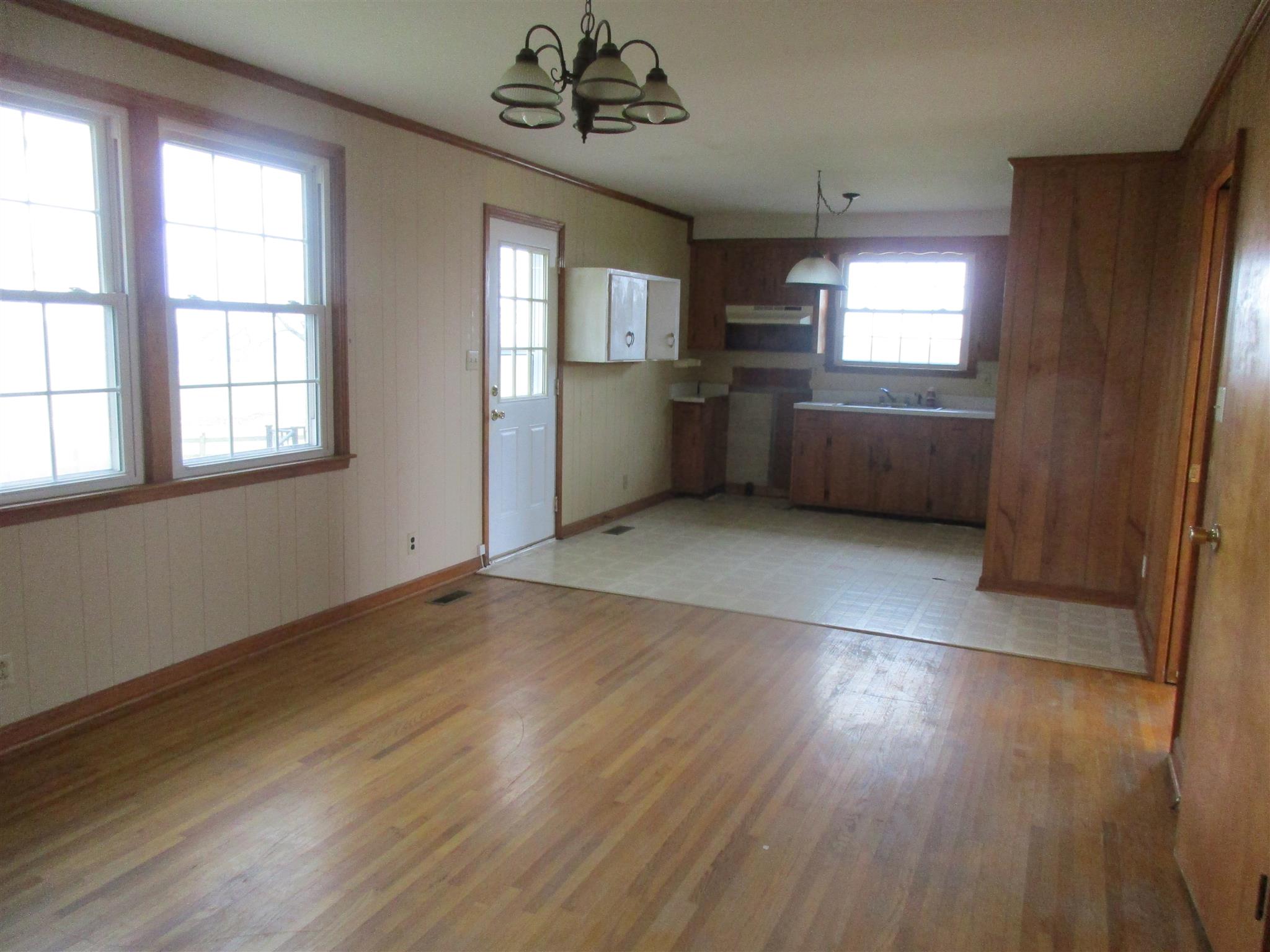 3779 Buck Road Clarksville, TN 37043 - Photo 7 of 12 a view of an empty room with a window and wooden floor