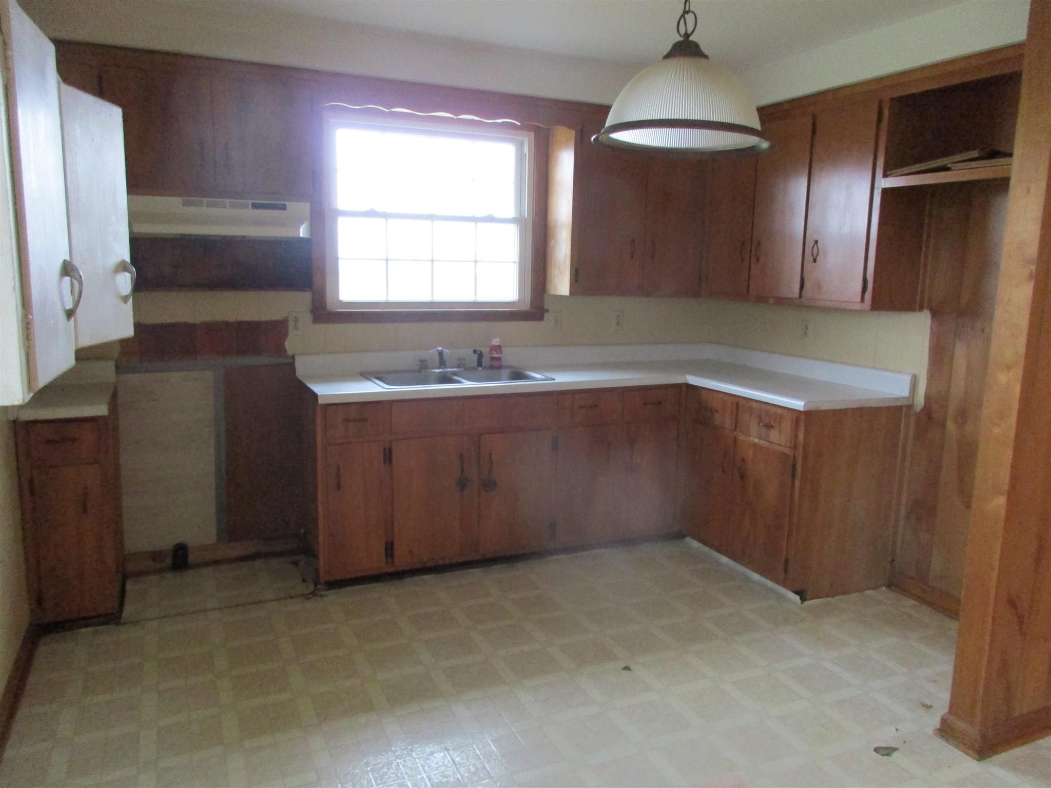 3779 Buck Road Clarksville, TN 37043 - Photo 8 of 12 a bathroom with a sink and a mirror