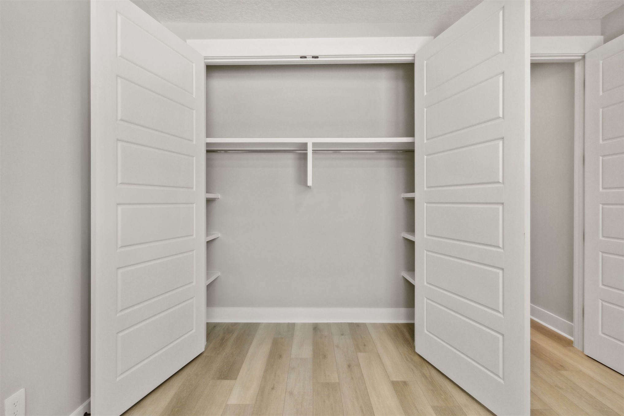 96050 Captains Pointe Road Yulee, FL 32097 - Photo 26 of 36 a view of walk in closet with empty racks