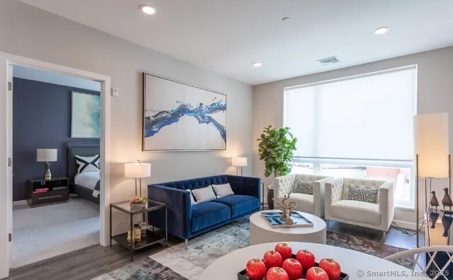 a room with pool table and windows