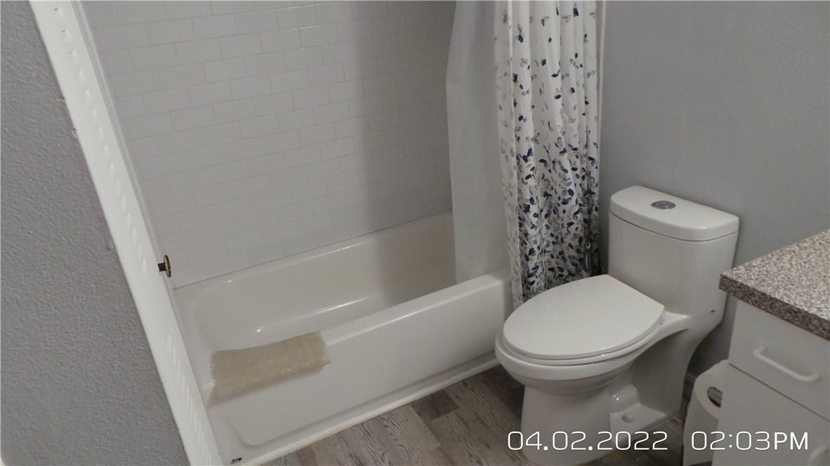 5001 Wiles Road, Unit 106 Pompano Beach, FL 33073 - Photo 17 of 31 a bathroom with a toilet and a shower