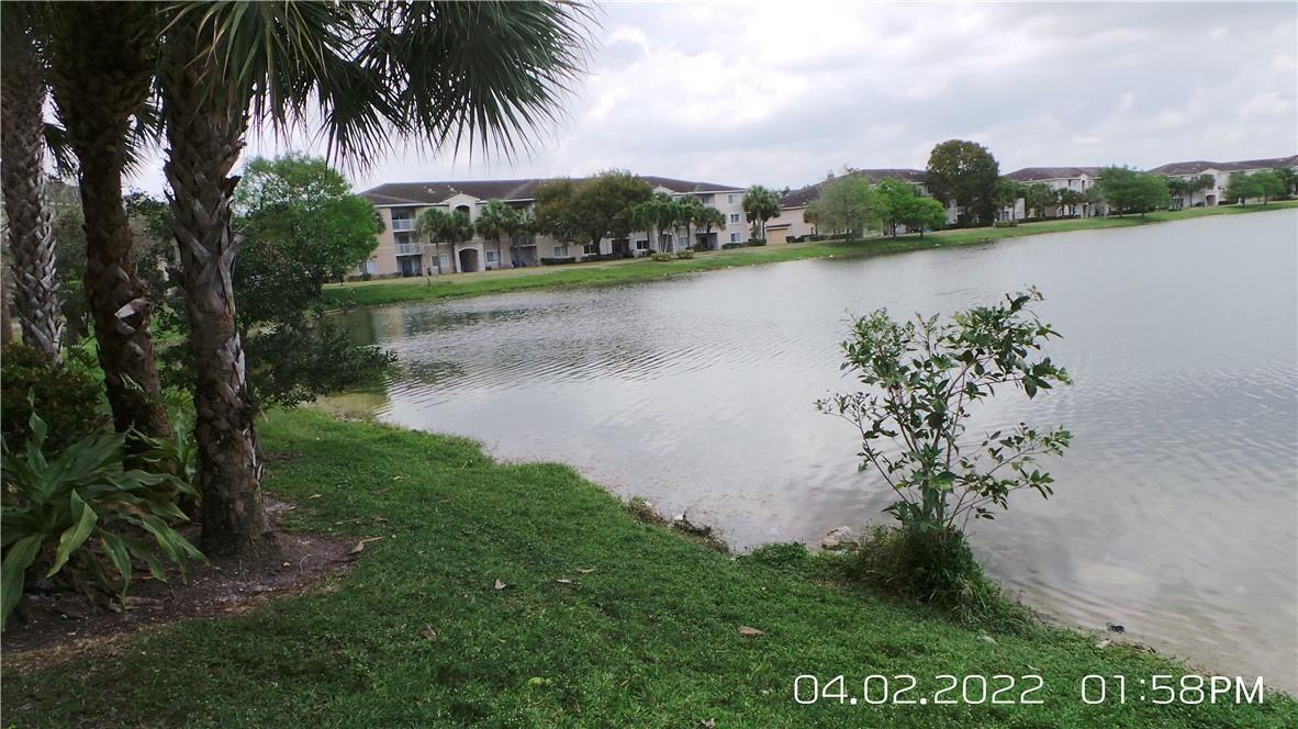 5001 Wiles Road, Unit 106 Pompano Beach, FL 33073 - Photo 22 of 31 a view of a lake with outdoor space