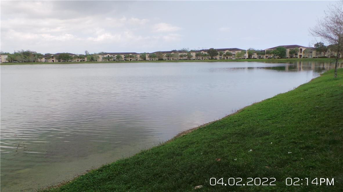5001 Wiles Road, Unit 106 Pompano Beach, FL 33073 - Photo 23 of 31 a view of a lake with a city view
