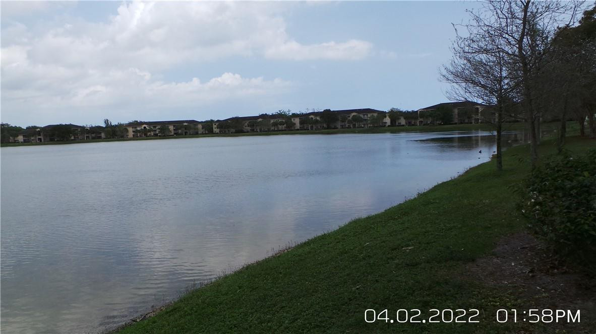 5001 Wiles Road, Unit 106 Pompano Beach, FL 33073 - Photo 24 of 31 a view of a lake