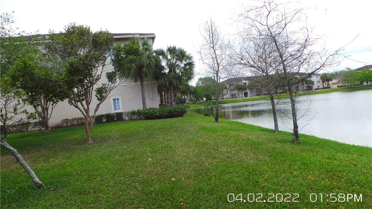 5001 Wiles Road, Unit 106 Pompano Beach, FL 33073 - Photo 28 of 31 a view of a park with large trees