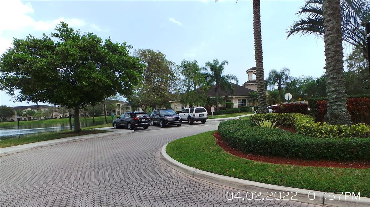 5001 Wiles Road, Unit 106 Pompano Beach, FL 33073 - Photo 31 of 31 a view of a park with potted plants and large trees