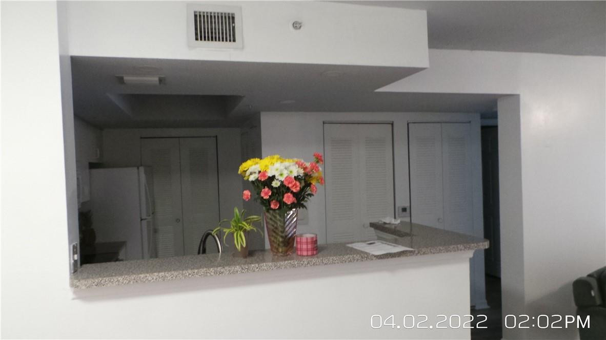 5001 Wiles Road, Unit 106 Pompano Beach, FL 33073 - Photo 9 of 31 a view of a hallway