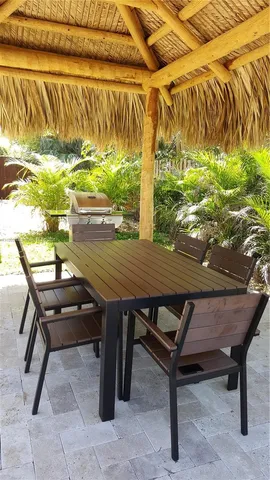 a terrace with outdoor seating and wooden floor