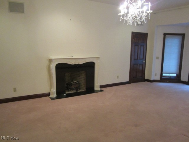 6999 Gates Road Gates Mills, OH 44040 - Photo 19 of 20 Unfurnished living room featuring a fireplace with flush hearth, a chandelier, and carpet