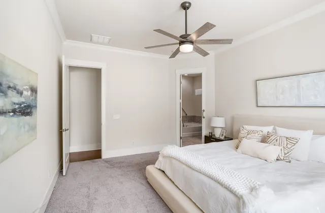 a bathroom with a granite countertop sink toilet and bathtub