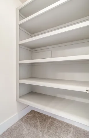 a aerial view of a house with a big yard and large tree