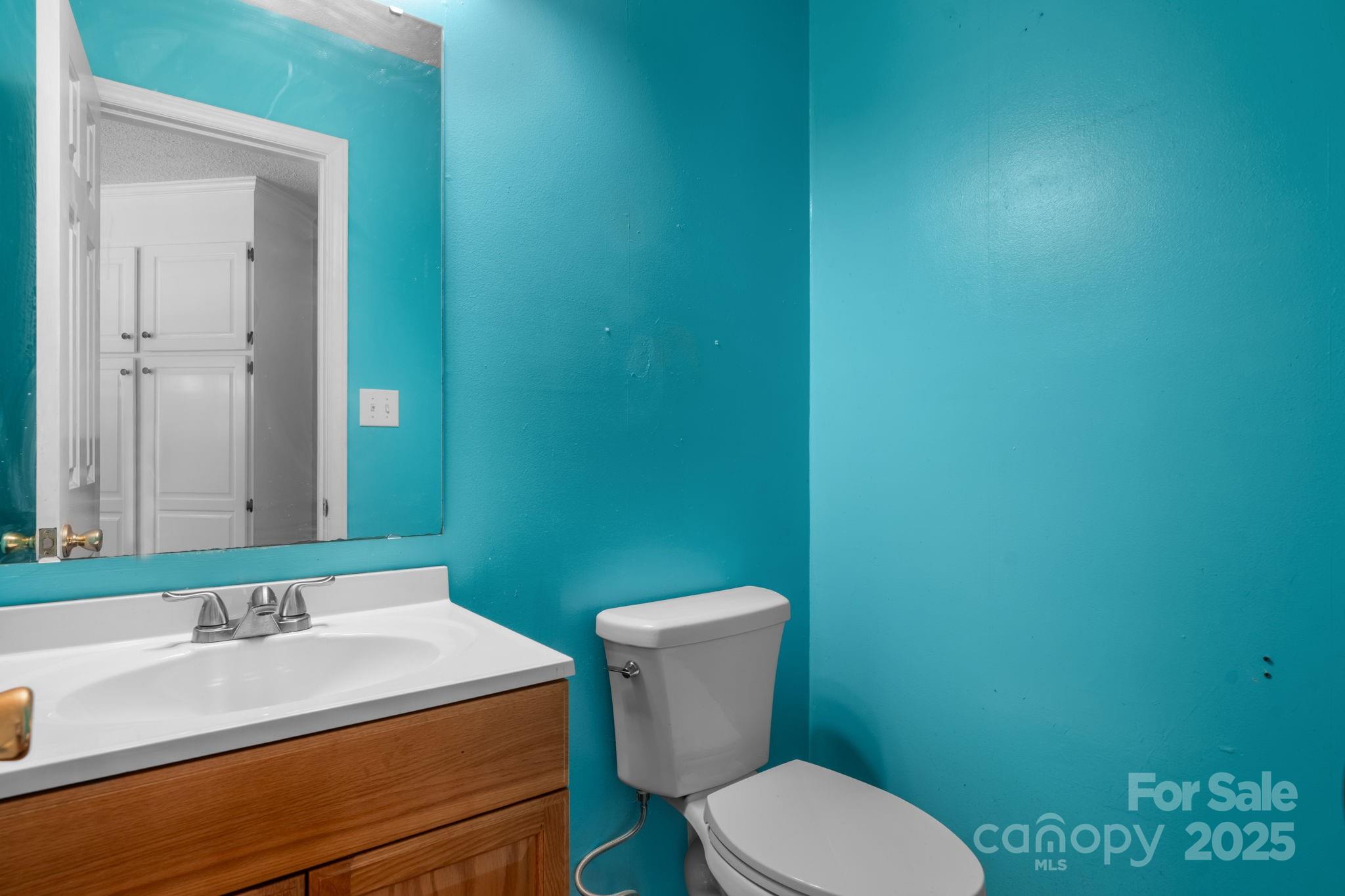 712 Painted Feather Lane Conover, NC 28613 - Photo 13 of 48 a bathroom with a granite countertop toilet and a sink