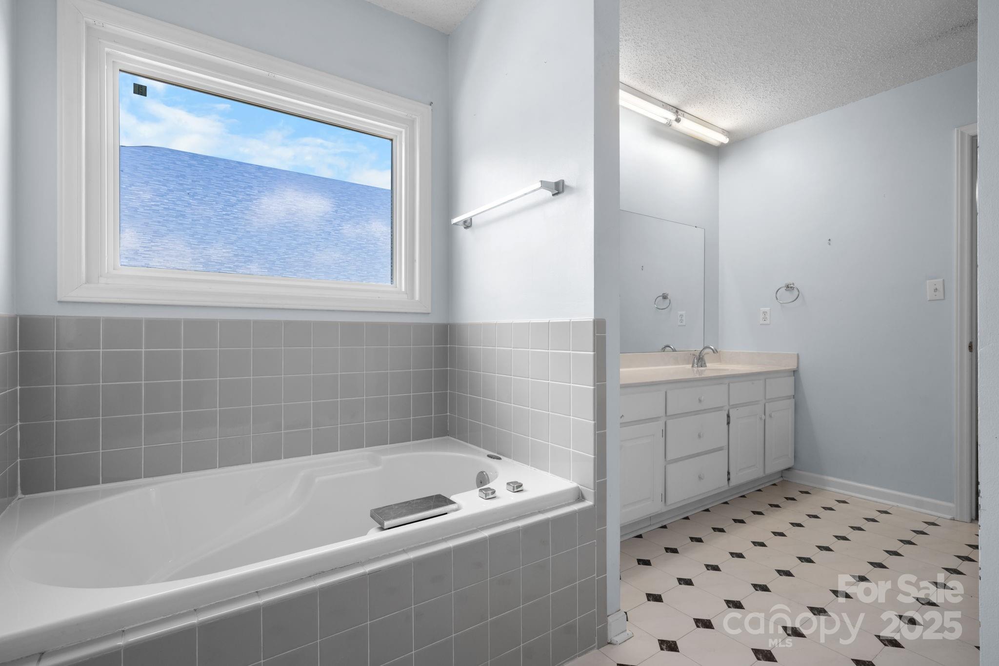 712 Painted Feather Lane Conover, NC 28613 - Photo 16 of 48 a bathroom with a bathtub sink and toilet