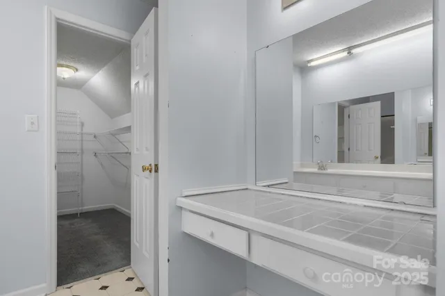 a bathroom with a sink and shower