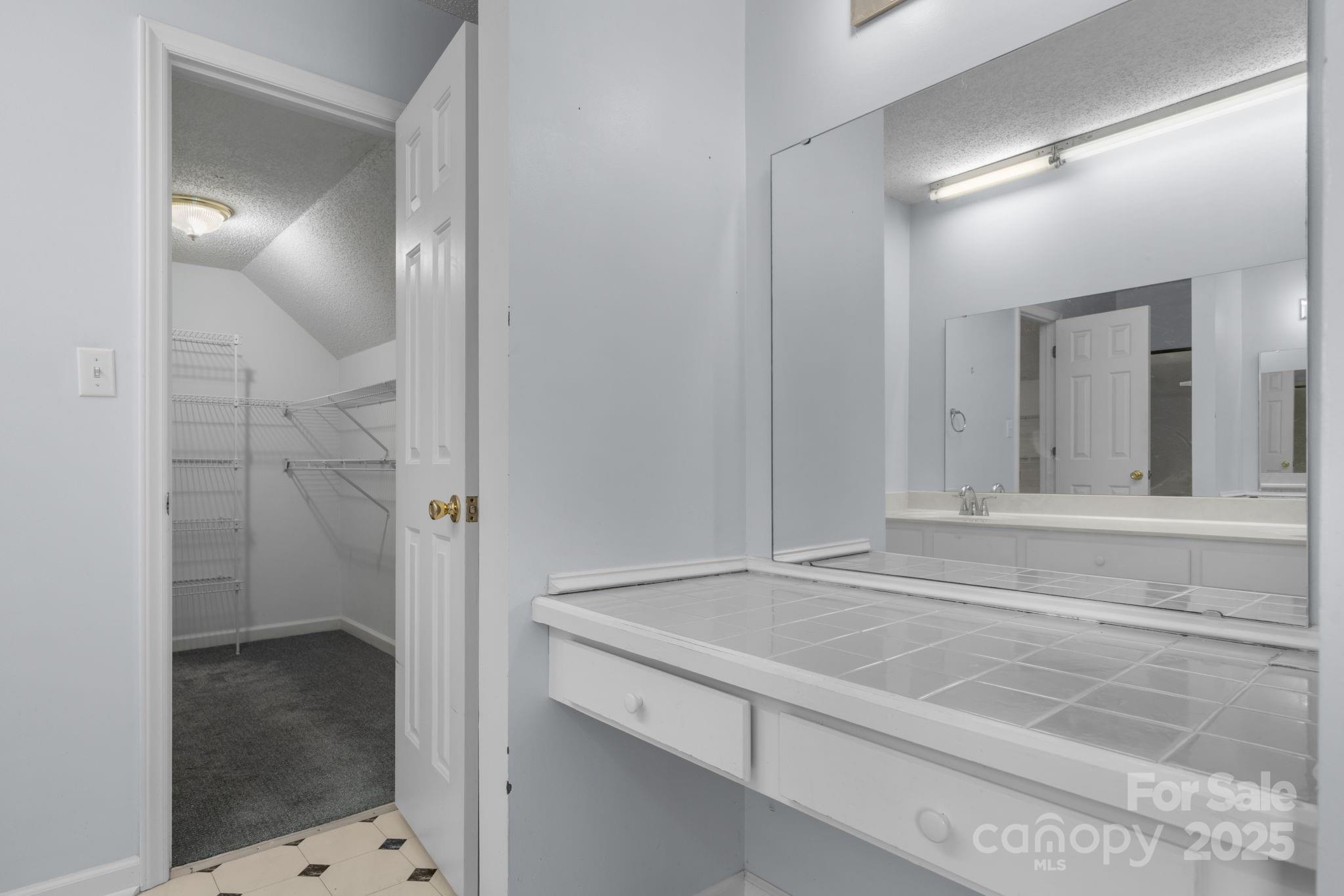 712 Painted Feather Lane Conover, NC 28613 - Photo 19 of 48 a bathroom with a sink and shower