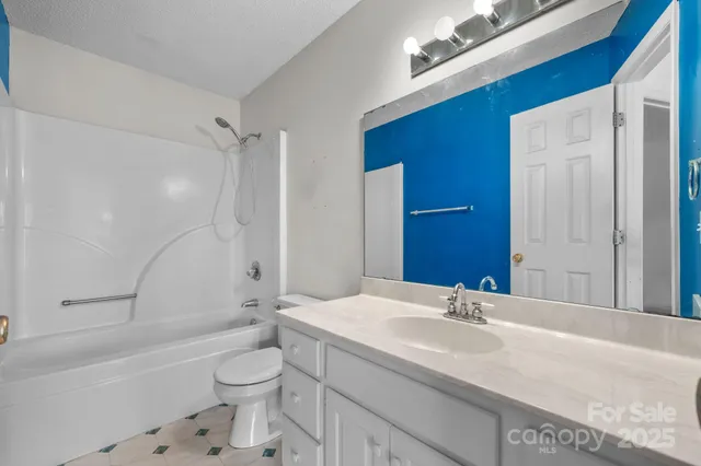 a bathroom with a sink a toilet and a bathtub