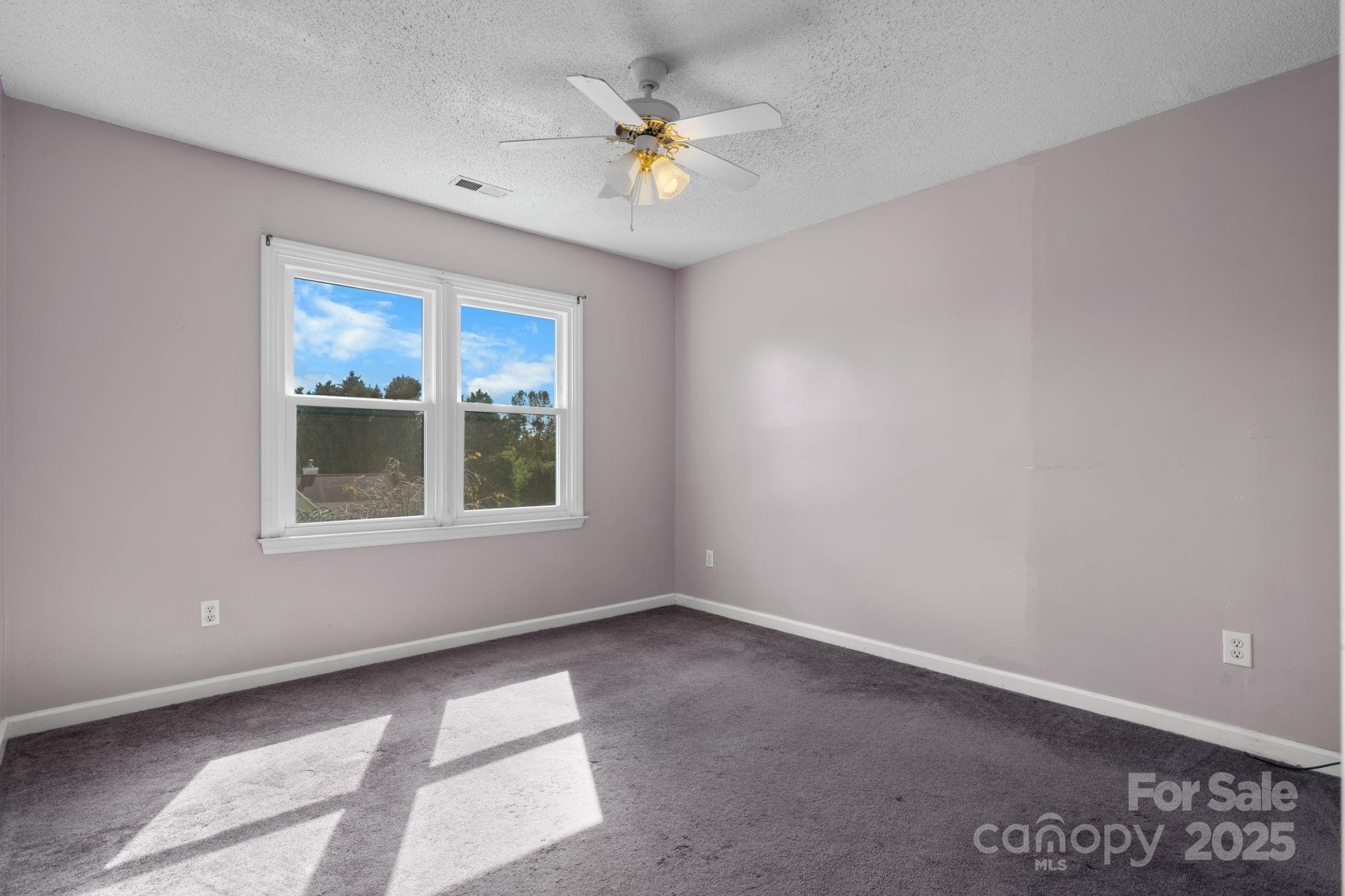 712 Painted Feather Lane Conover, NC 28613 - Photo 24 of 48 a view of an empty room with a window