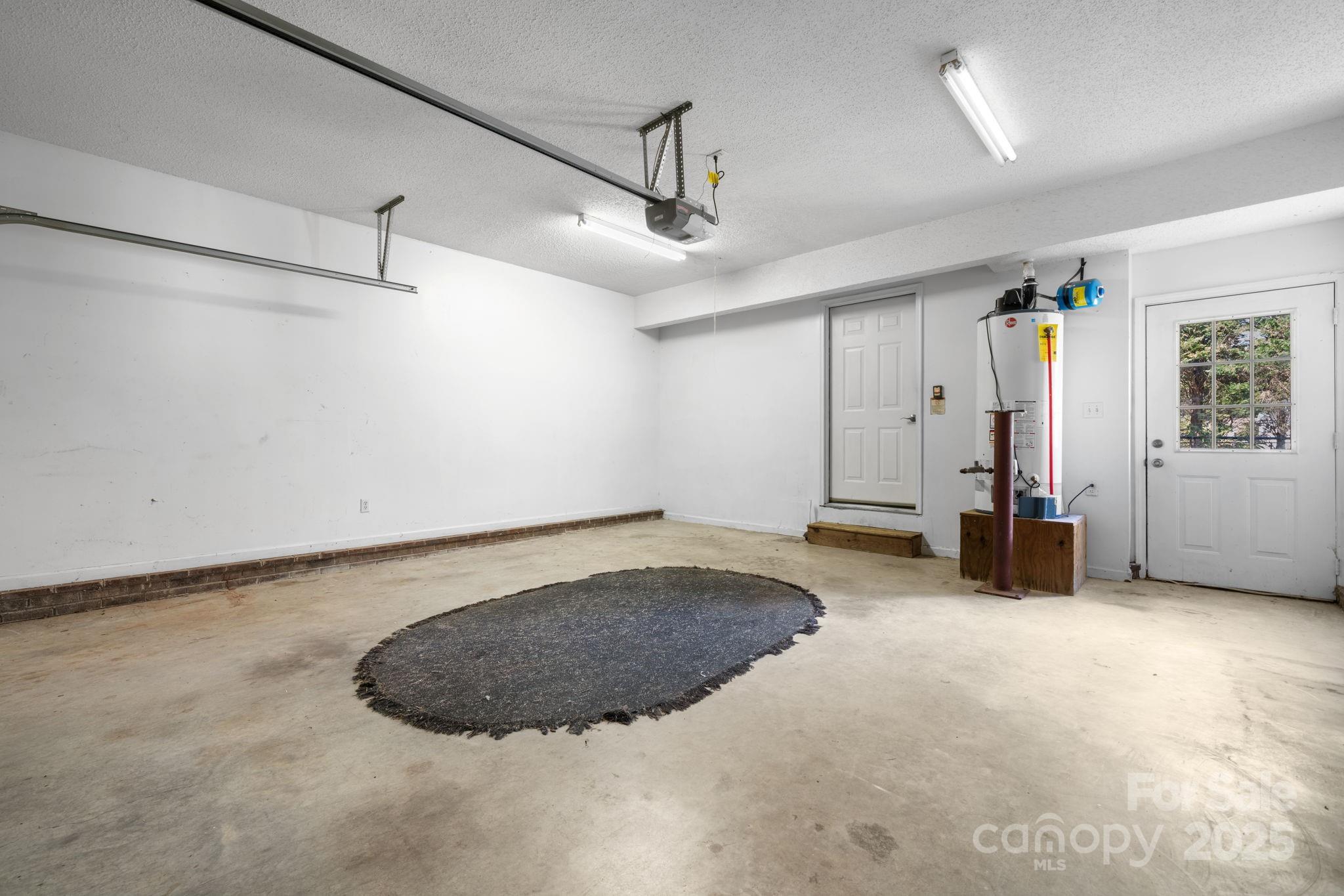 712 Painted Feather Lane Conover, NC 28613 - Photo 27 of 48 a view of a livingroom with a ceiling fan and window