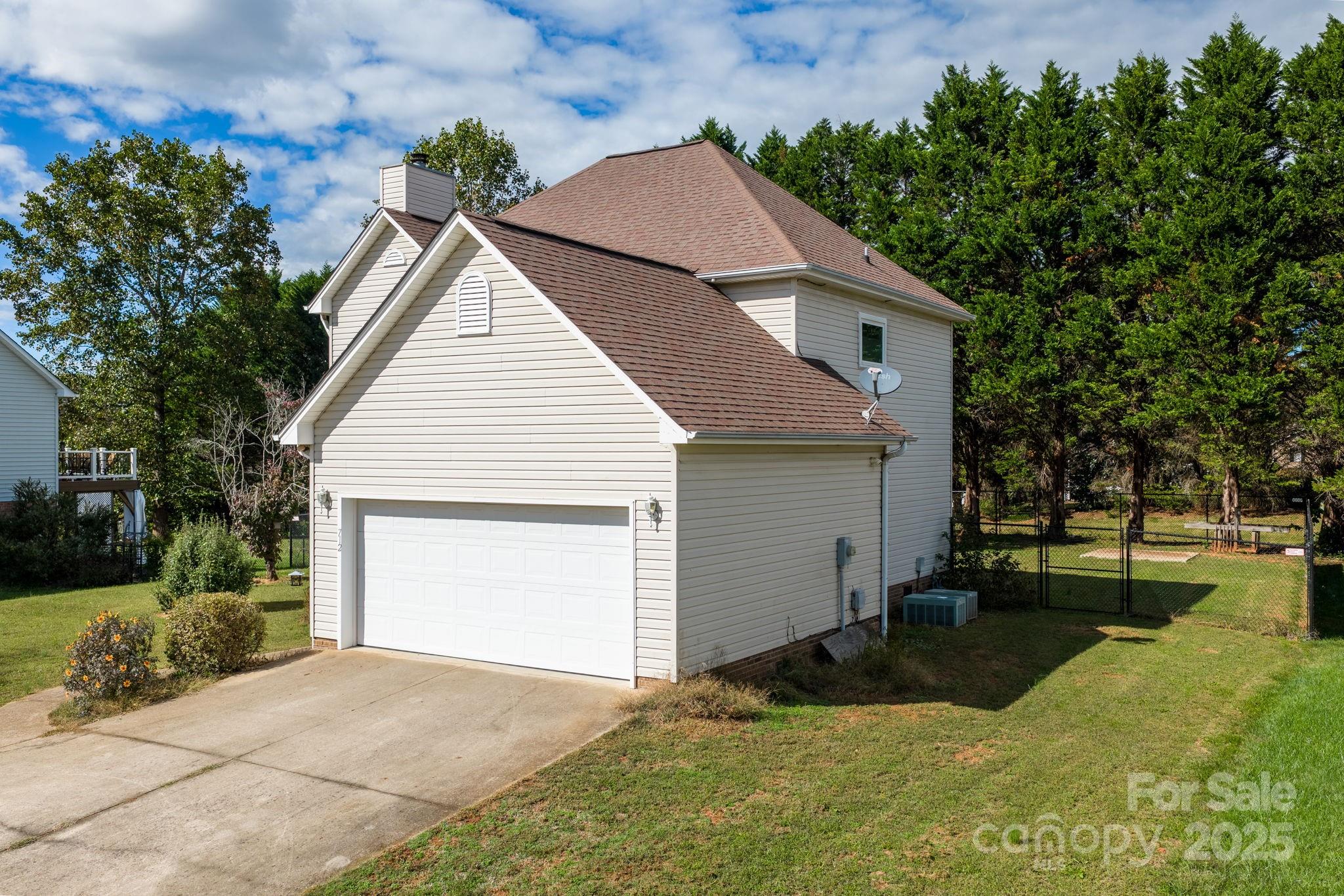 712 Painted Feather Lane Conover, NC 28613 - Photo 31 of 48 a view of backyard of house with green space