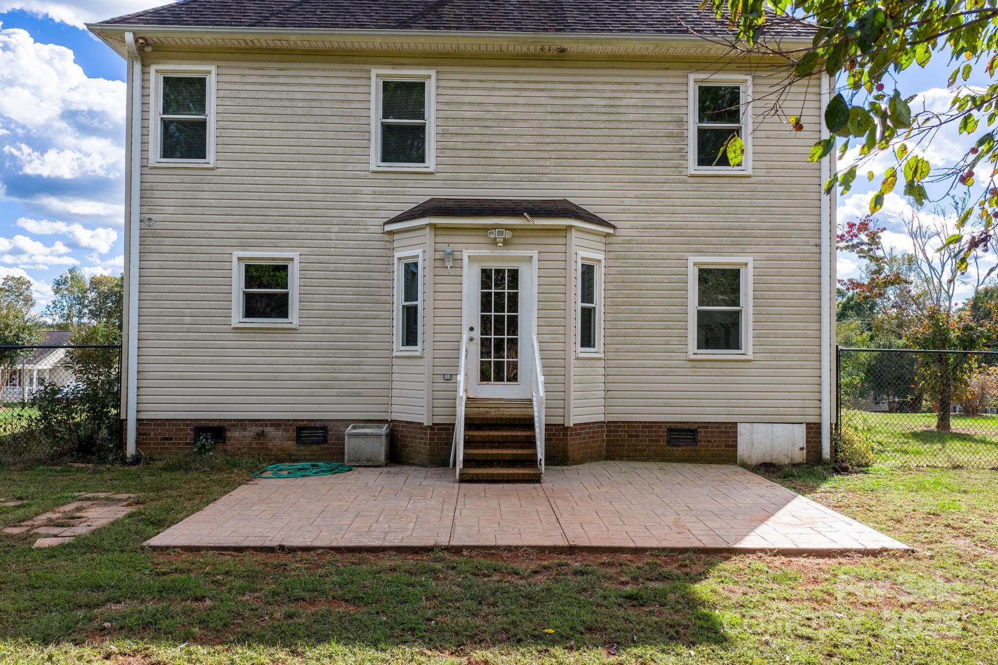 712 Painted Feather Lane Conover, NC 28613 - Photo 40 of 48 a front view of a house with a yard