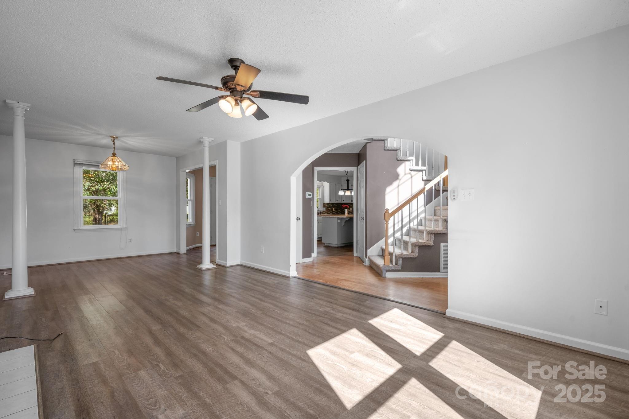 712 Painted Feather Lane Conover, NC 28613 - Photo 4 of 48 a view of entryway and hall with wooden floor