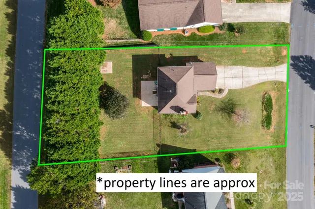 an aerial view of a house with a garden