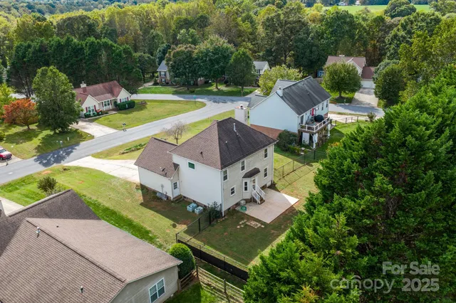 an aerial view of a house with a garden