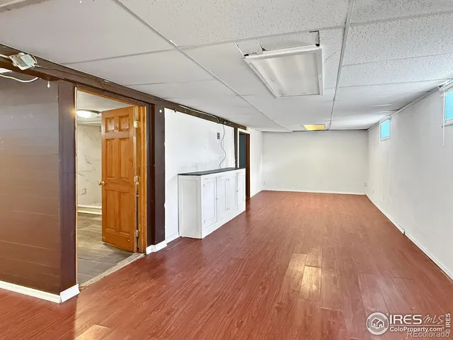 a view of hallway with wooden floor