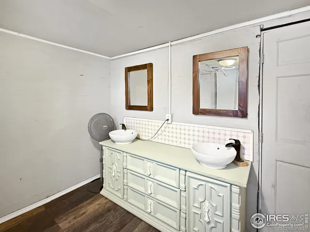 a bathroom with a sink a vanity and a mirror