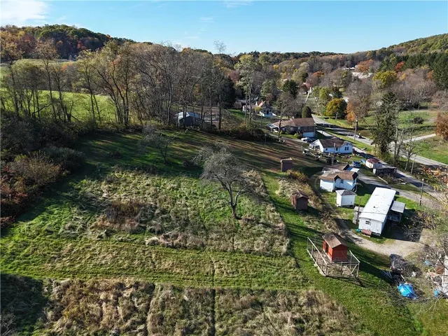 an aerial view of residential house with outdoor space