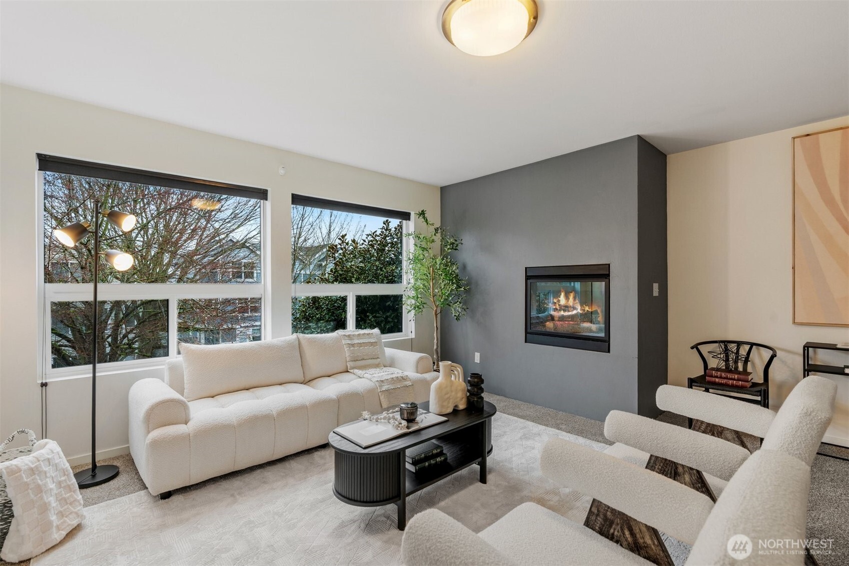 6536 42nd Avenue Southwest, Unit B Seattle, WA 98136 - Photo 12 of 27 a living room with furniture and a large window