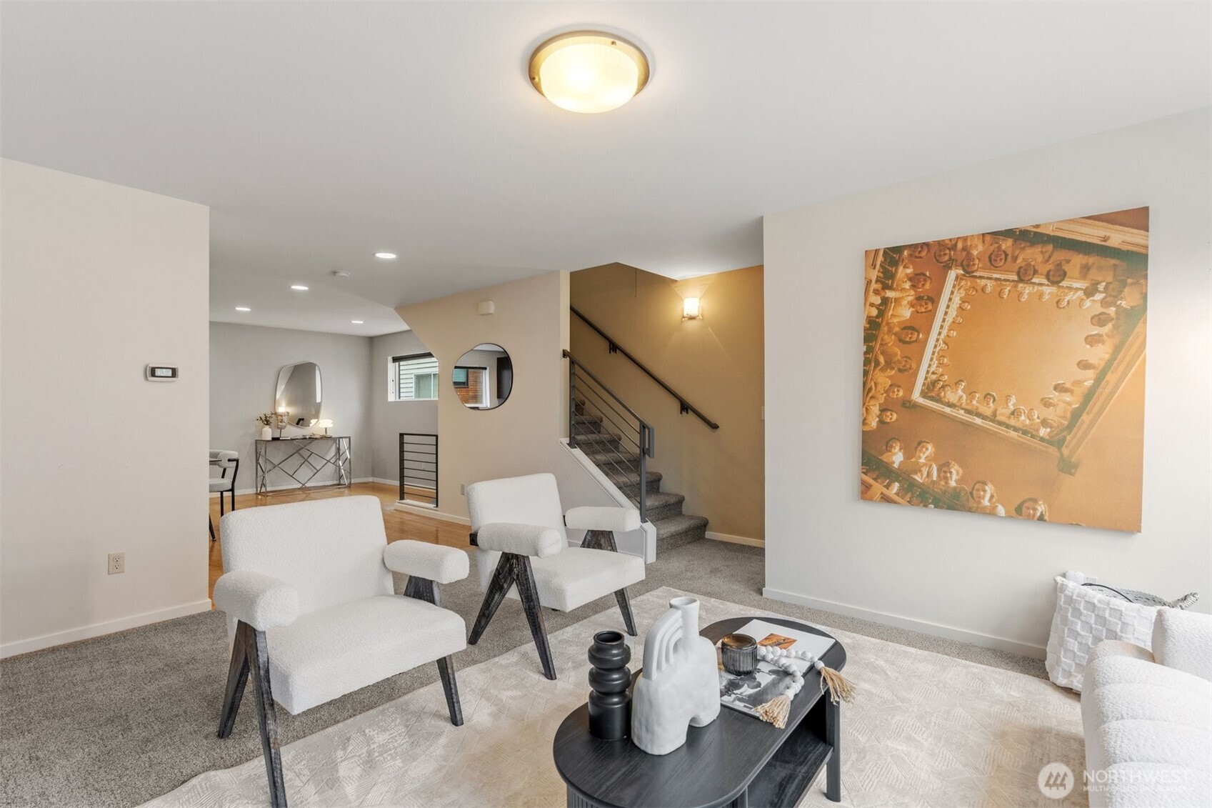 6536 42nd Avenue Southwest, Unit B Seattle, WA 98136 - Photo 14 of 27 a living room with furniture and a chandelier