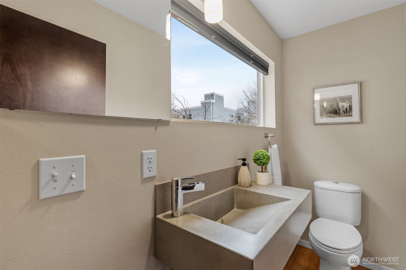 6536 42nd Avenue Southwest, Unit B Seattle, WA 98136 - Photo 15 of 27 a bathroom with a toilet a sink and mirror