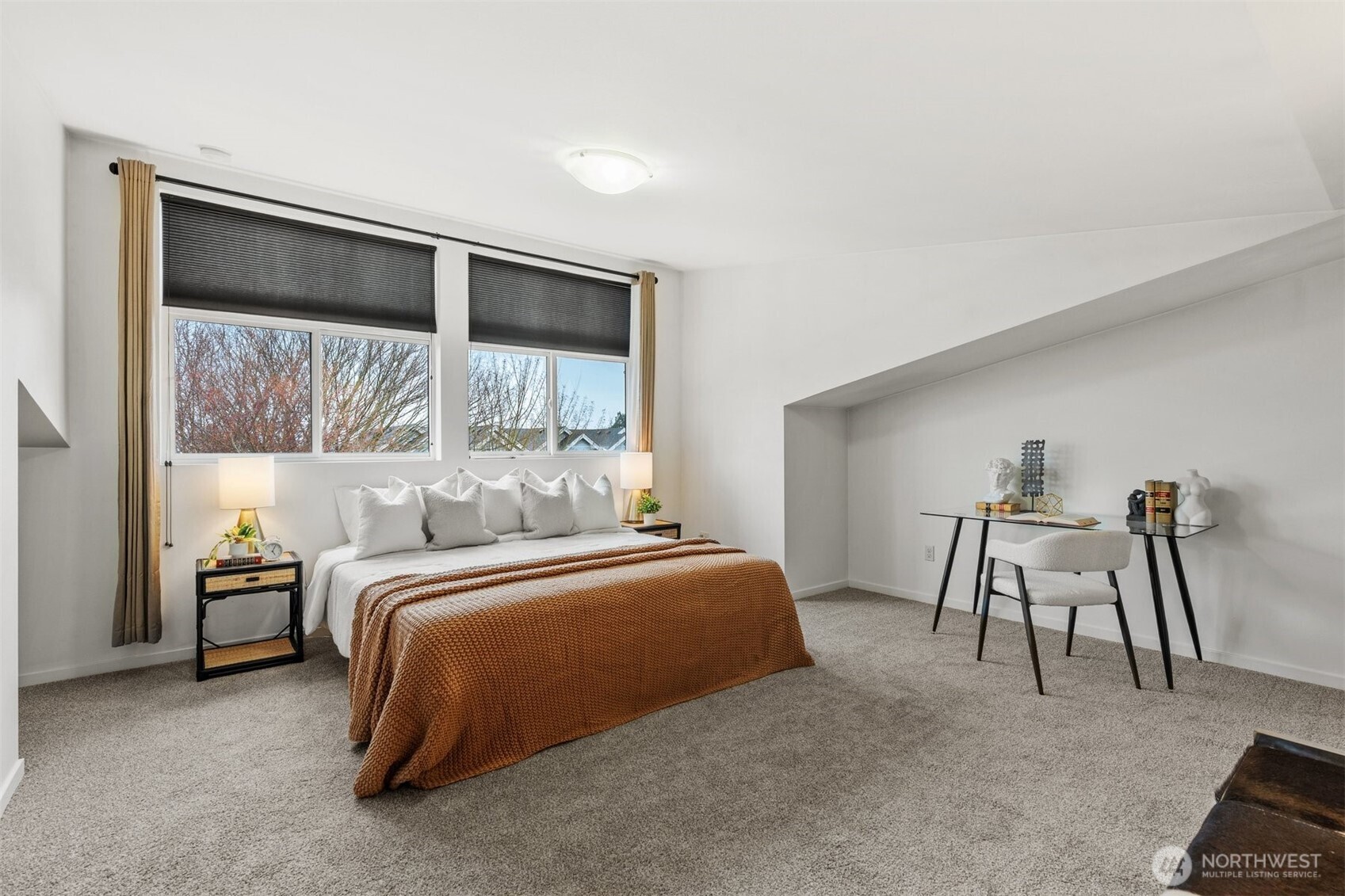 6536 42nd Avenue Southwest, Unit B Seattle, WA 98136 - Photo 17 of 27 a bedroom with a bed and a desk