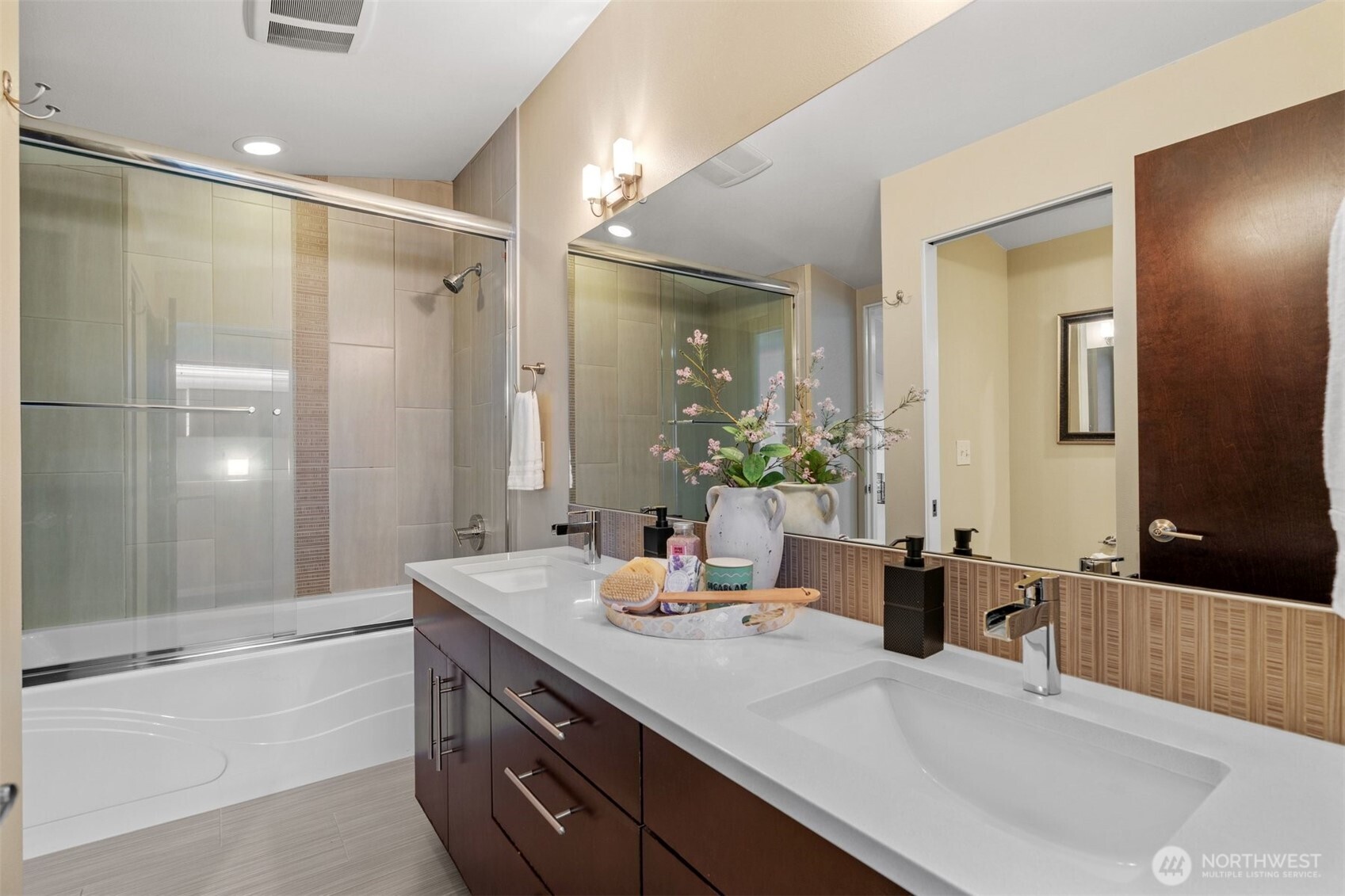 6536 42nd Avenue Southwest, Unit B Seattle, WA 98136 - Photo 19 of 27 a bathroom with a granite countertop sink and a mirror