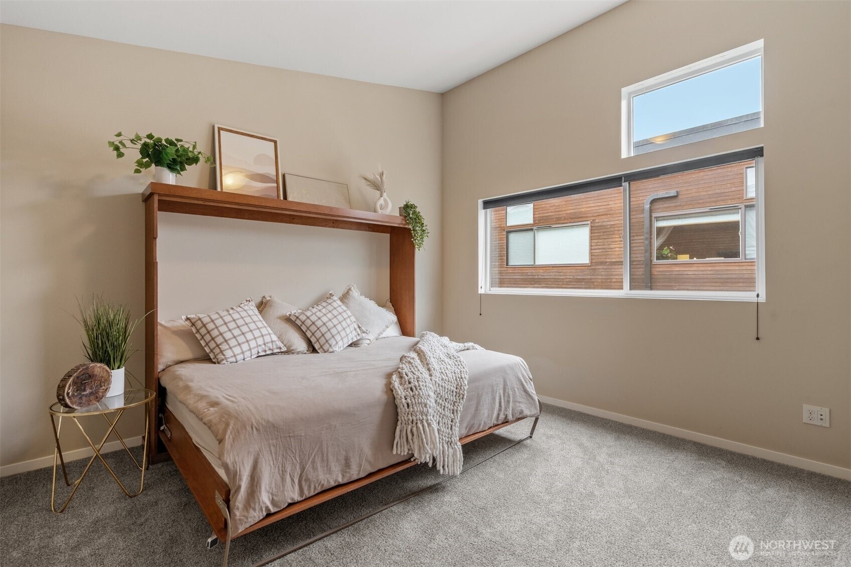 6536 42nd Avenue Southwest, Unit B Seattle, WA 98136 - Photo 20 of 27 a bedroom with a bed and window